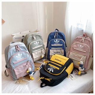 The new backpack male and female student schoolbag junior high school high-capacity Korean campus sports backpack fashion trend