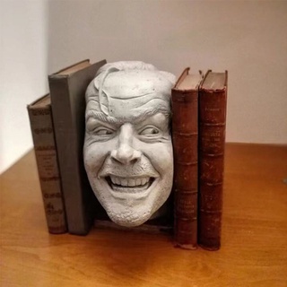 escultura del libro brillante biblioteca aquí está johnny escultura