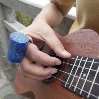 Instrumento de percusión de dedos para guitarra