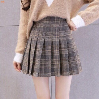Nueva falda plisada de lana de tela escocesa pequeña Falda corta fresca alta cintura alta delgada contra falda exterior de desgaste de una falda de palabra