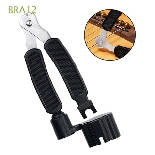 BRA12 Music guitarra cambiador de cuerdas instrumento cortador enrollador accesorios 3 en 1 multifunción herramienta extractor de pines/Multicolor