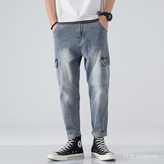 Moda marca ancho de la pierna Jeans de los hombres rectos sueltos de la juventud de la moda de los hombres harén elástico Jeans nuevo