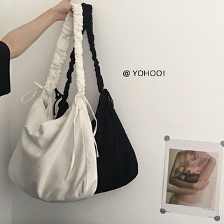 Dongdong spot bolsa de lona 2021 versión coreana de la nueva bolsa de lona con cordón simple ins estudiante mujer color sólido de gran capacidad bolsa de mensajero de un solo hombro mujer