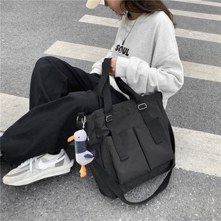 Dongdong spot bolsa de lona bolsa impermeable bolsa de lona de gran capacidad mensajero femenino estudiante coreano ins japonés solo hombro bolso grande mochila escolar estilo universitario
