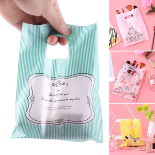 Muñecas 50 bolsas de plástico de regalo con mango varios patrones de embalaje bolso de joyería embalaje pequeño tamaño 15cmx20cm tienda de compras suministros de fiesta caramelo galletas bolsillo (6)